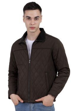 A man wearing a dark Olive quilted jacket with a collar neck, zipper closure and pocket in hand designed for casual winter layering and comfort.